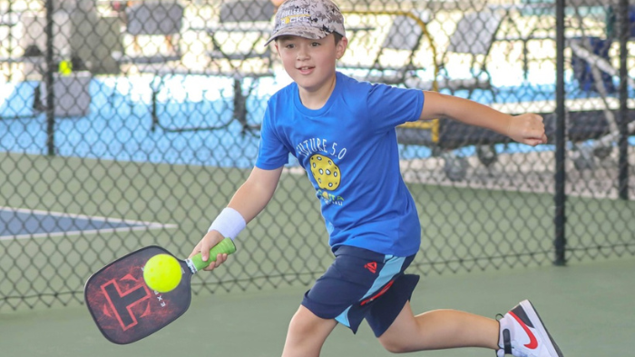 Child Playing Pickleball With Junior Pickleball Paddle Making Him Learning Proper Technique