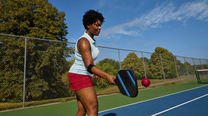 Pickleball Player Wearing Elbow Brace And Playing Pickleball