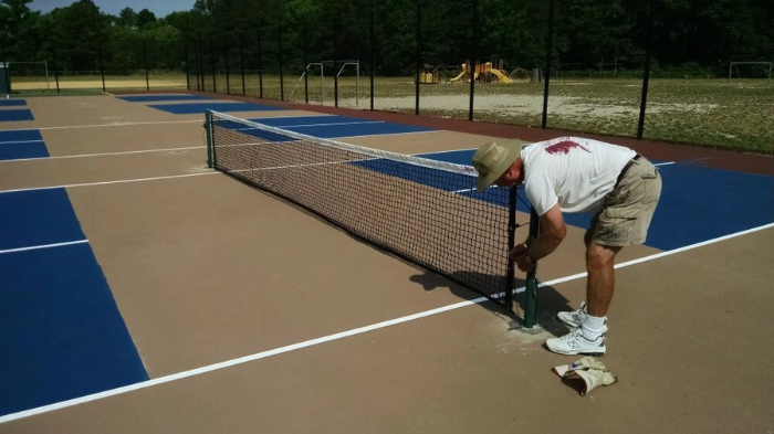 Installation Of A Pickleball Net For Setting Up Your Own Outdoor Pickleball Court
